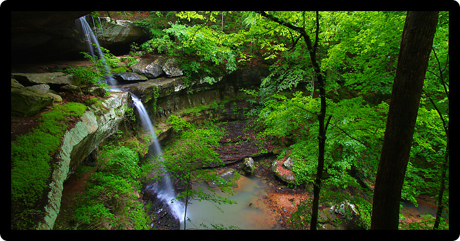 Beautiful waterfall flows into a deep canyon in the woodland of northern Alabama.