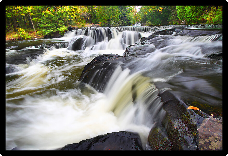 Beautiful Bond Falls flows through the forests of northwoods Michigan.