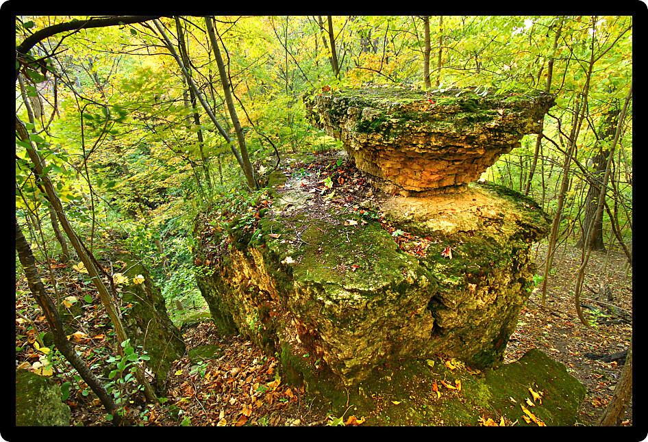 Autumn scenery surrounds an interesting rock formation in Illinois.