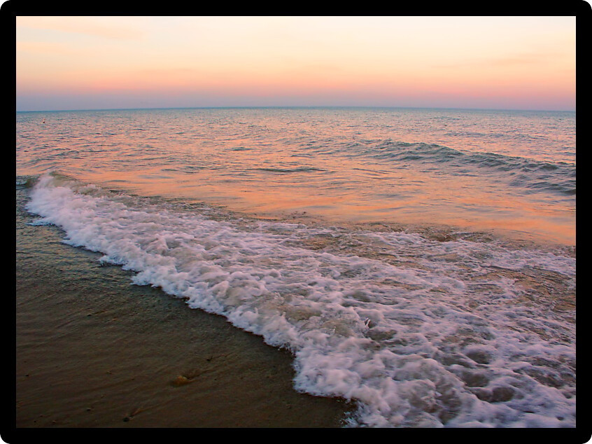 Waves under a beautiful Lake Michigan sunset at Illinois Beach State Park.