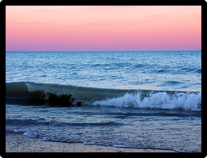 Waves under a beautiful Lake Michigan sunset at Illinois Beach State Park.