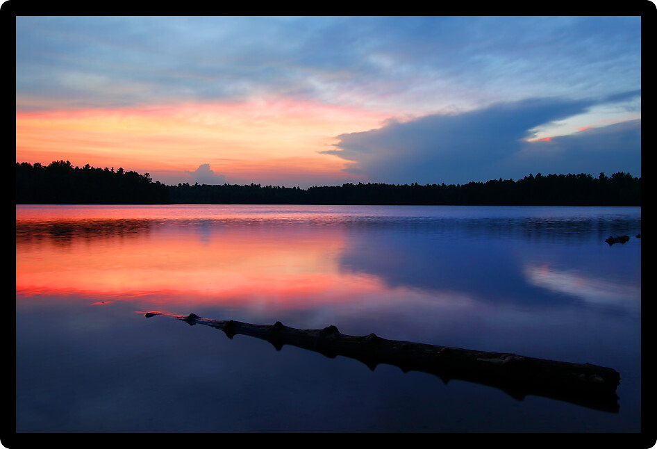 Brilliant colors of sunset over Buffalo Lake in the Northern Highland American Legion State Forest of Wisconsin.