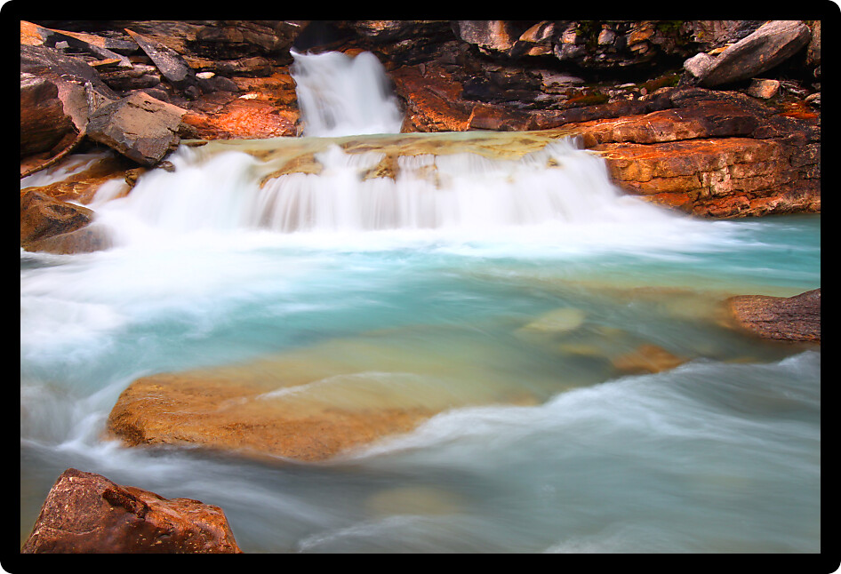 Cascades of glacial water below Twin Falls of Yoho National Park in Canada.