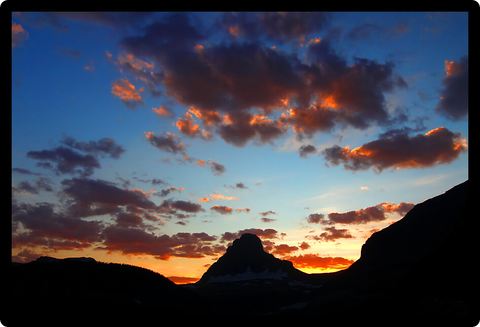 Beautiful hues of sunset over the mountains of Glacier National Park in Montana.