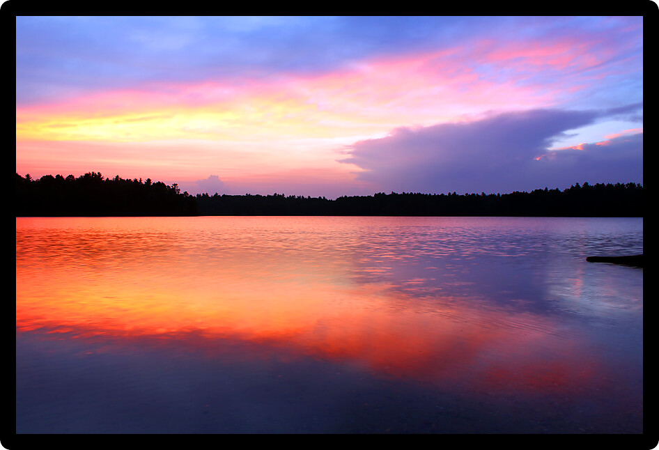 Brilliant colors of sunset over Buffalo Lake in the Northern Highland American Legion State Forest of Wisconsin.
