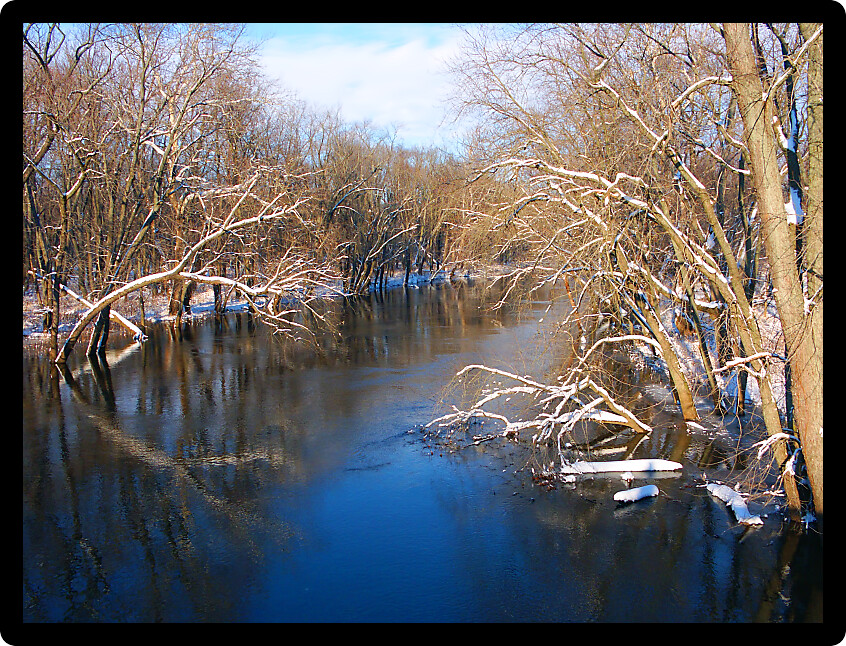 Sangamon River in central Illinois under a brilliant blue sky.