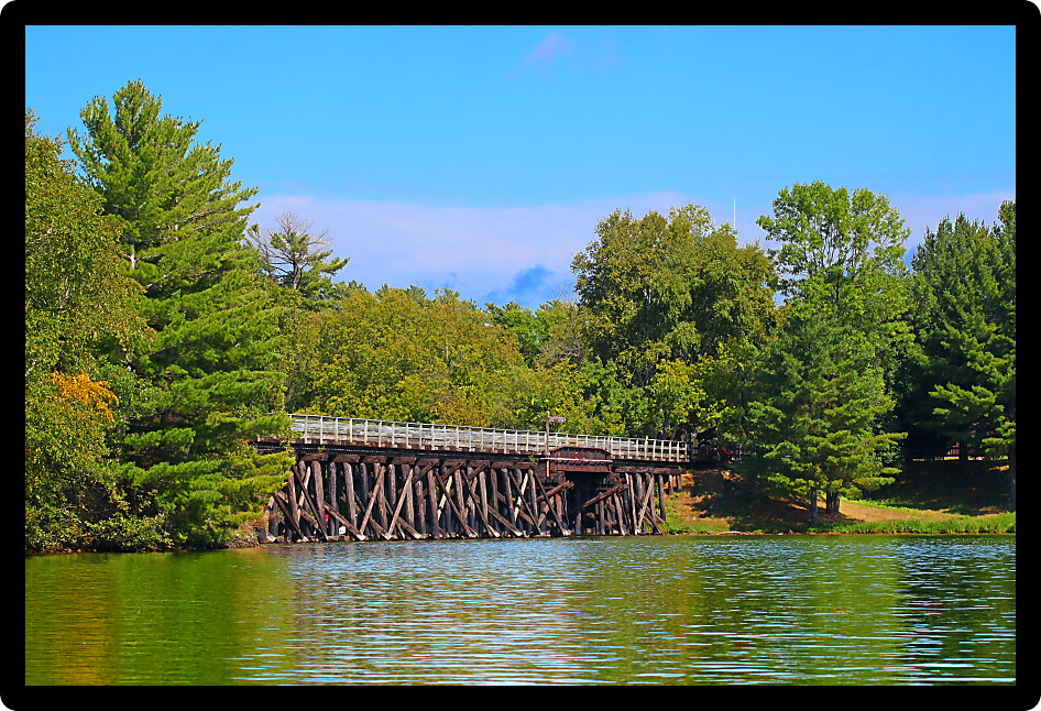 Rustic wooden trestle across the Bearskin State Trail in Minocqua Wisconsin.