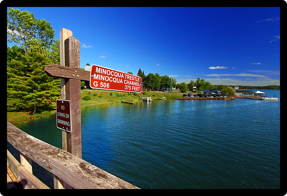 Rustic wooden trestle across the Bearskin State Trail in Minocqua Wisconsin.