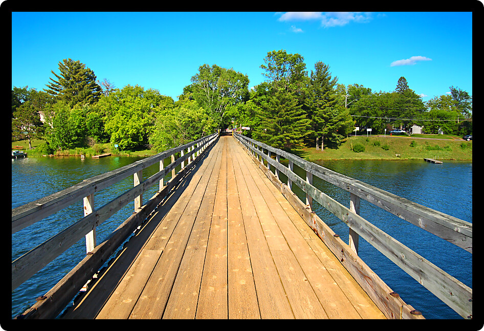 Rustic wooden trestle across the Bearskin State Trail in Minocqua Wisconsin.