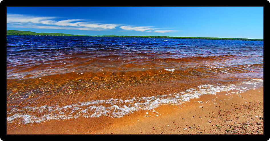 Panoramic beach landscape of Lake Gogebic in northwoods Michigan.