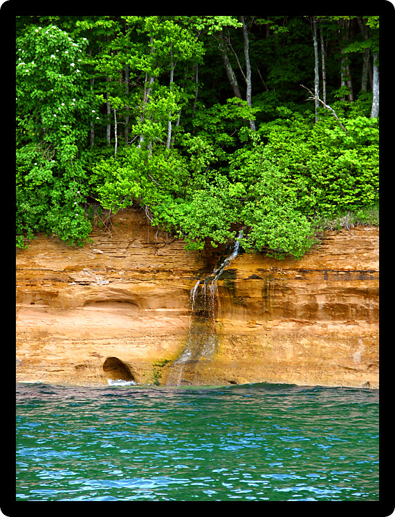 Small waterfall flows into Lake Superior at Pictured Rock National Lakeshore in Michigan.