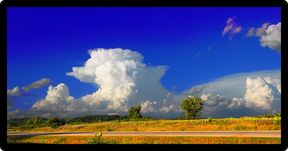 Supercell thunderstorm erupting over the farmlands of Rock County Wisconsin in the summer of 2015.
