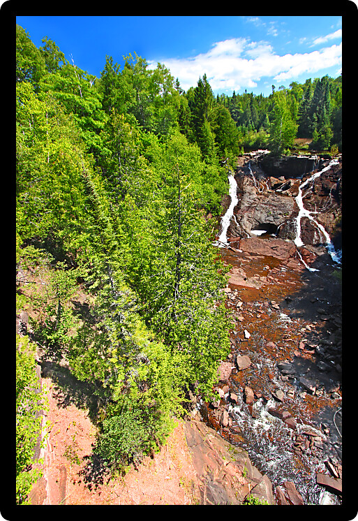 Eagle River Falls cascades down a rocky cliff in the Keweenaw Peninsula of Michigan.