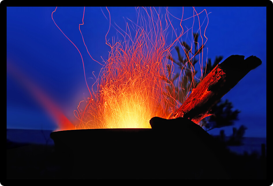 Sparks fly from a campfire along the beach of Lake Superior in northern Michigan.