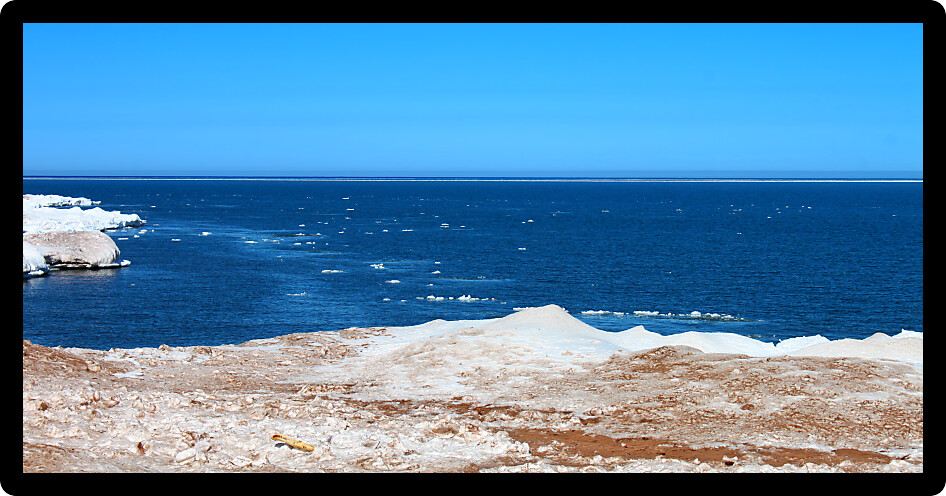 Ice and snow along the shoreline of Lake Superior in northern Michigan.