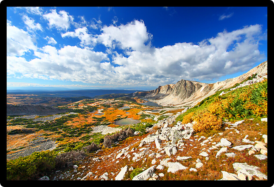 Sunlight shines along the eastern face of Medicine Bow Peak in the national forests of Wyoming.