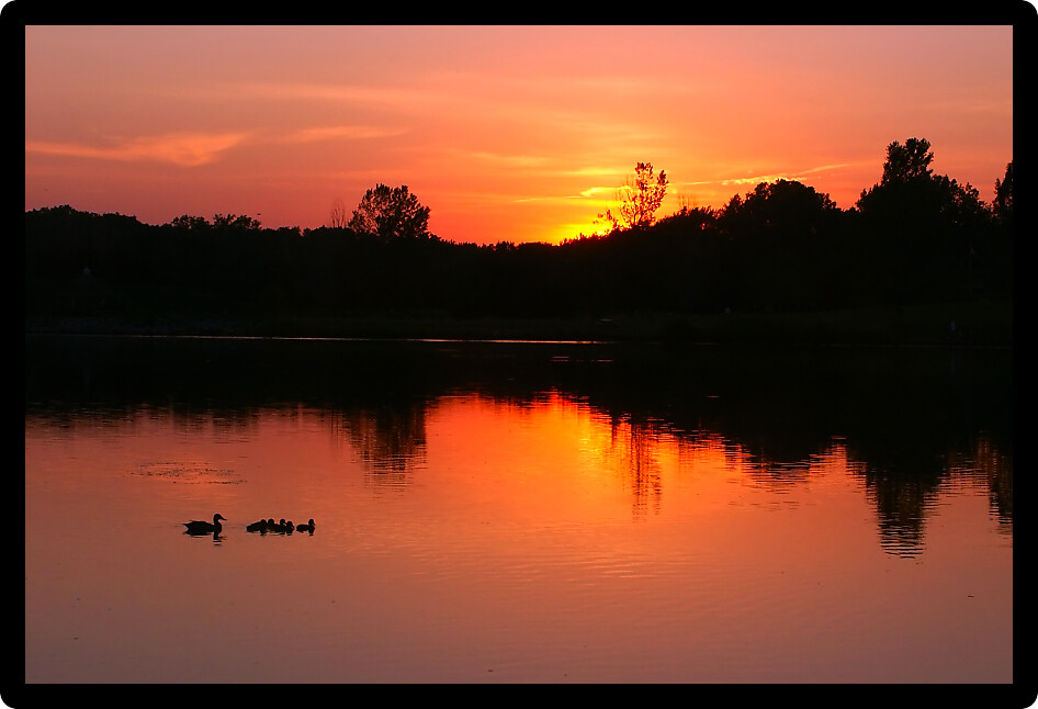 Sunset over Bauman Park Lake in Cherry Valley Illinois.