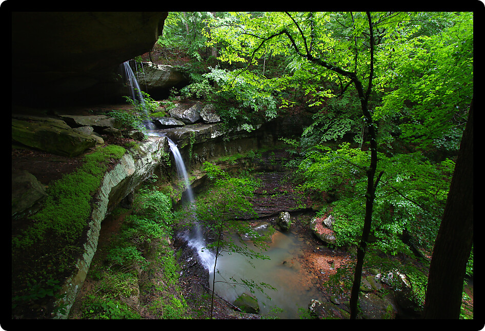 Waterfall flows into a deep canyon in the woodland of northern Alabama.