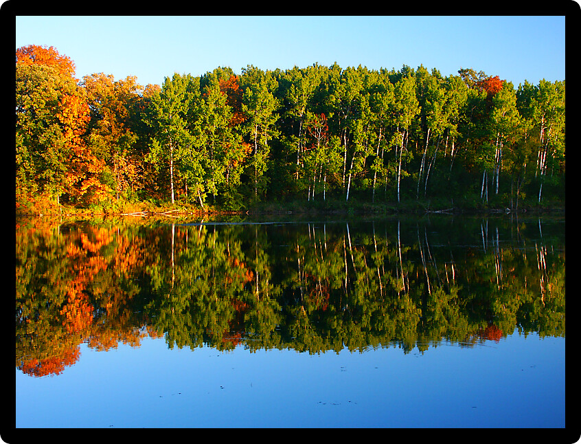 Beautiful fall colors reflect off a pond at Kettle Moraine State Forest in Wisconsin.