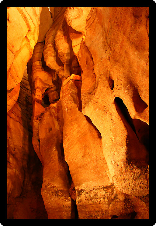 Tall but narrow corridor through Rickwood Caverns in Alabama.
