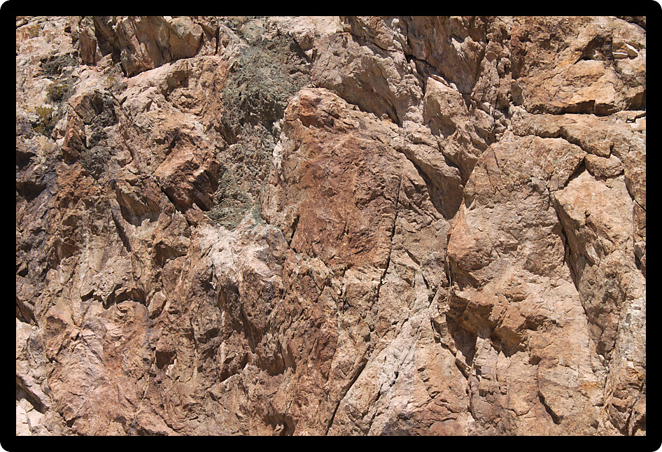 Background imagery of a jagged rock wall in Nevada.