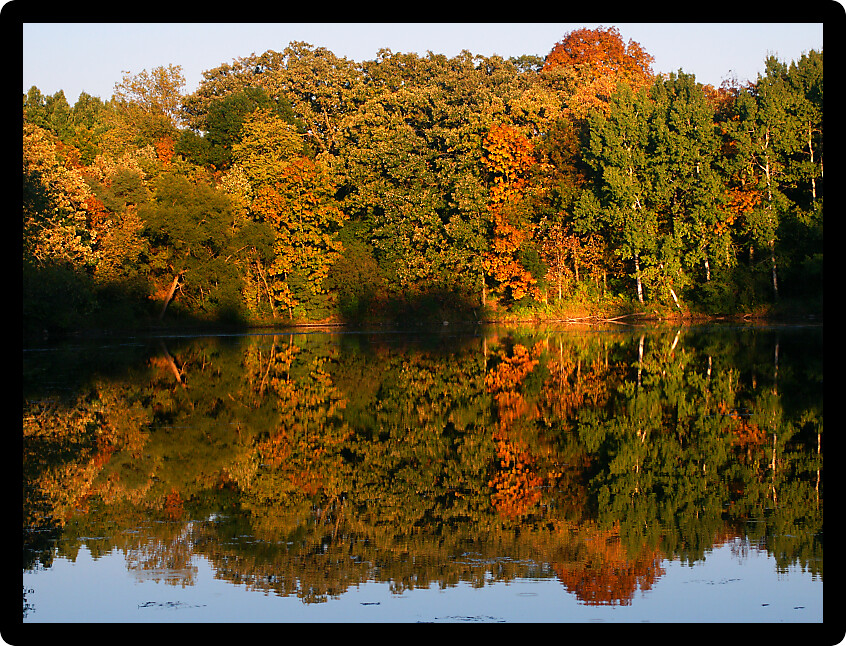 Beautiful fall colors reflect off a pond at Kettle Moraine State Forest in Wisconsin.