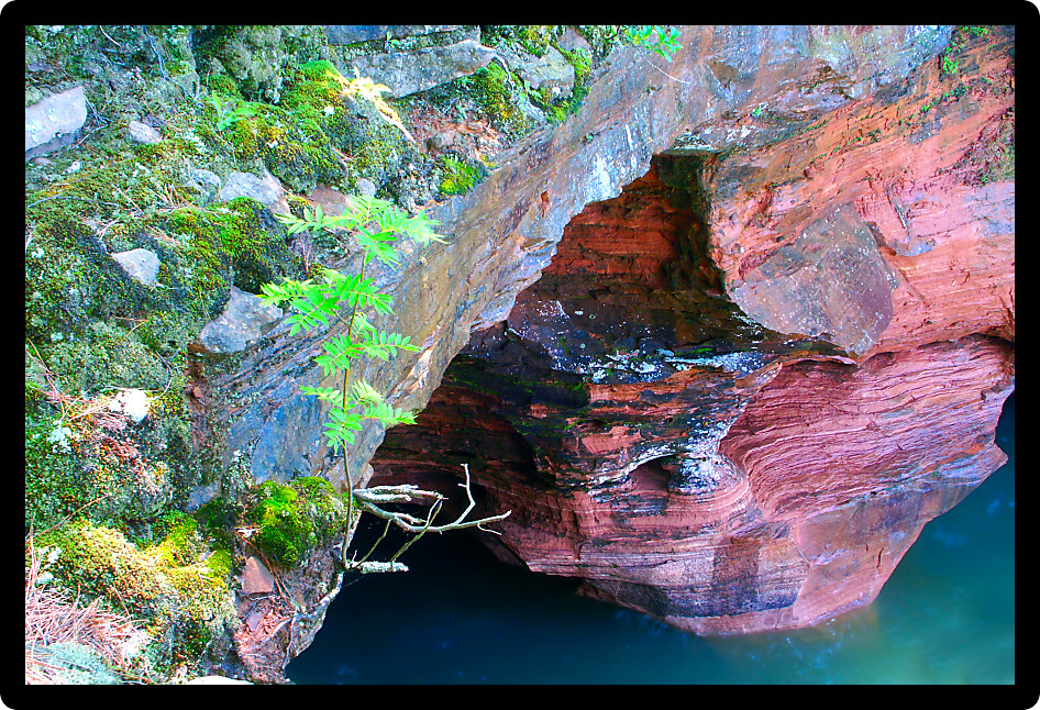 Large cave opens into the shores of Wisconsin at Apostle Island National Lakeshore.