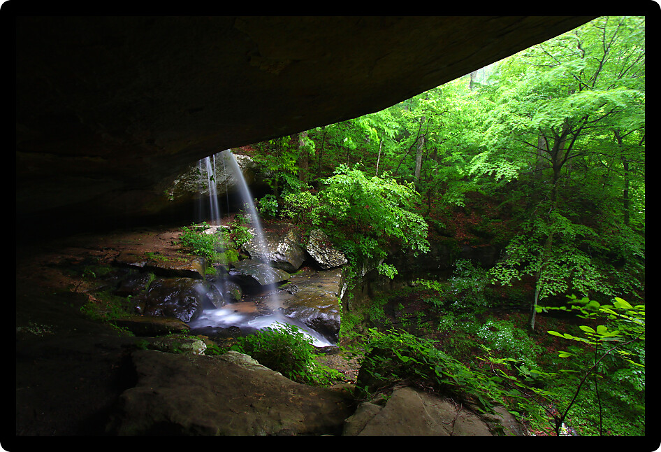 Waterfall flows into a deep canyon in the woodland of northern Alabama.