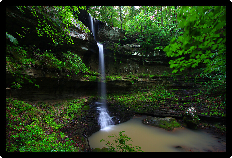Waterfall flows into a deep canyon in the woodland of northern Alabama.