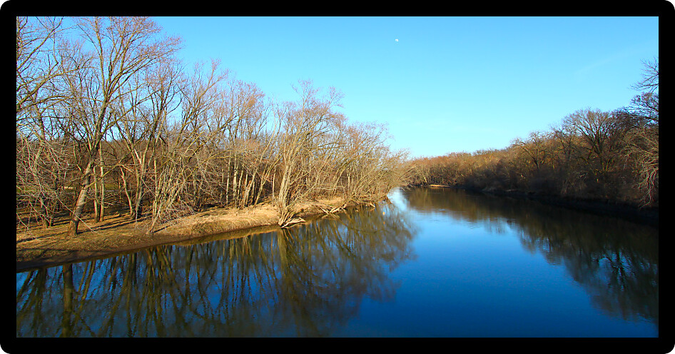 Trees reflect off the Kishwaukee river in northern Illinois.
