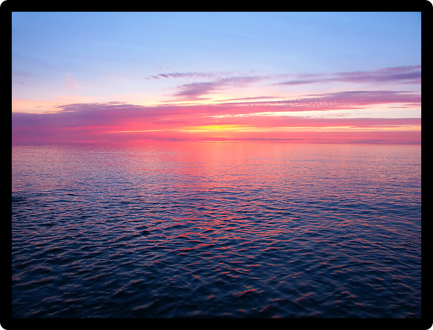 Beautiful pink colors reflect off Lake Superior in northern Michigan.