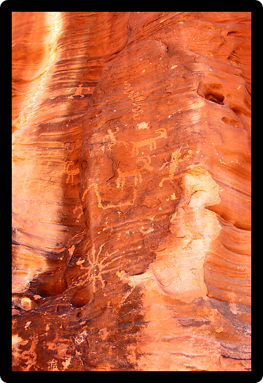 Strange petroglyphs on a rock wall at Valley of Fire State Park in Nevada.