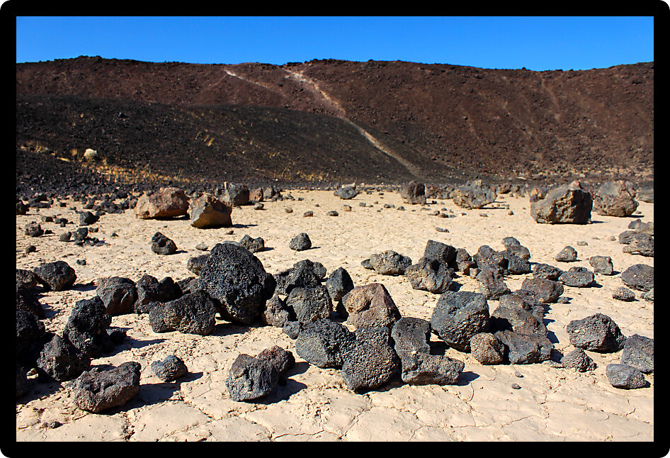 Volcanic rock scatters the center of Amboy Crater in the deserts of southern California.