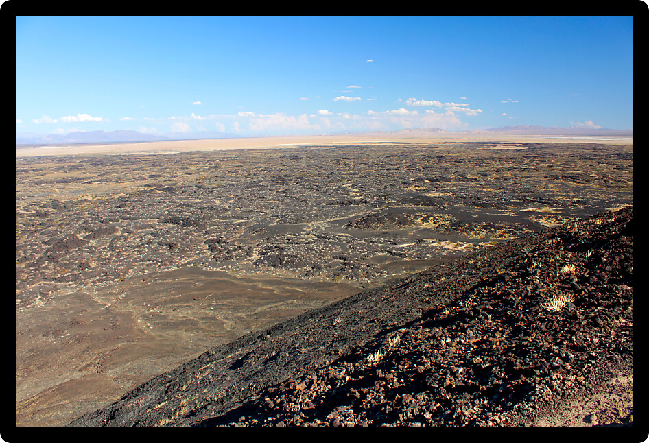 Volcanic rock scatters the desert around Amboy Crater National Natural Landmark in California.