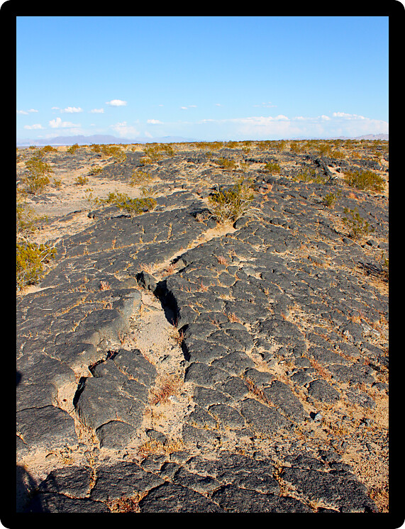 Volcanic rock scatters the desert around Amboy Crater National Natural Landmark in California.