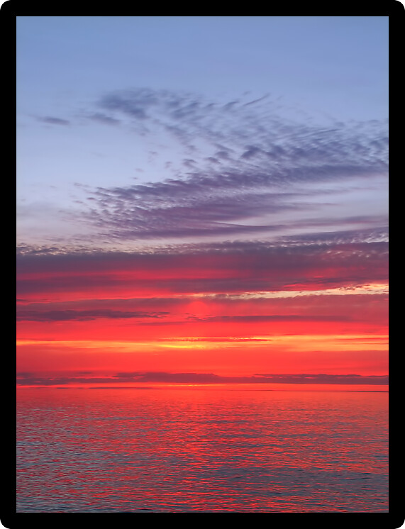 Beautiful pink colors reflect off Lake Superior in northern Michigan.