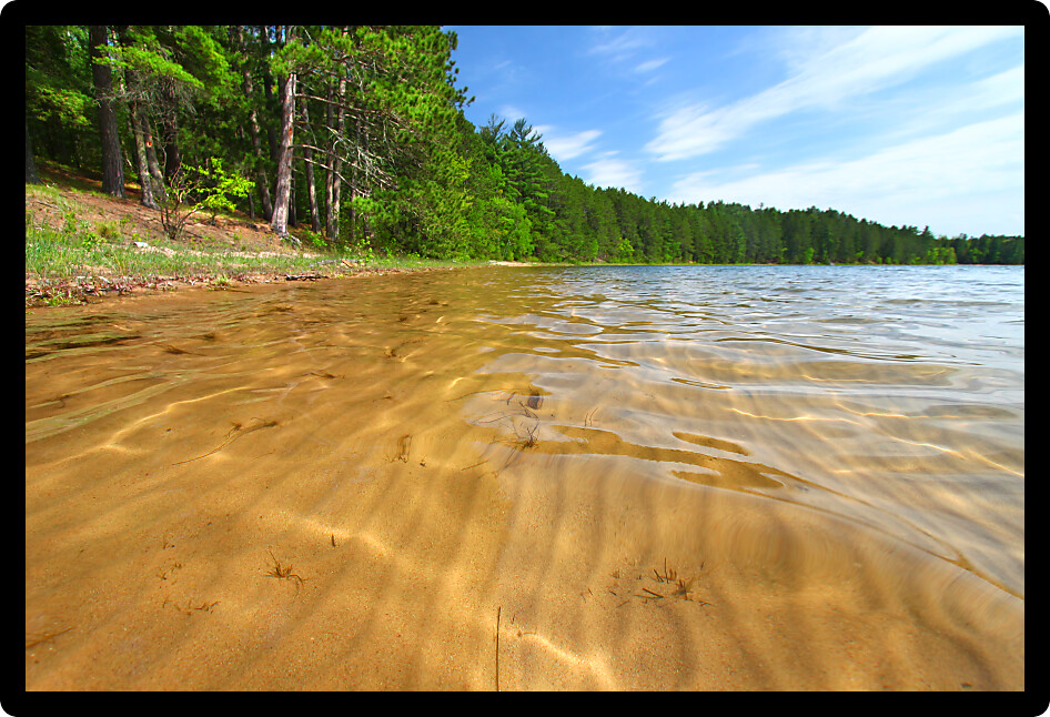 Patterns in the sand of a cool and crystal clear northwoods Wisconsin Lake.