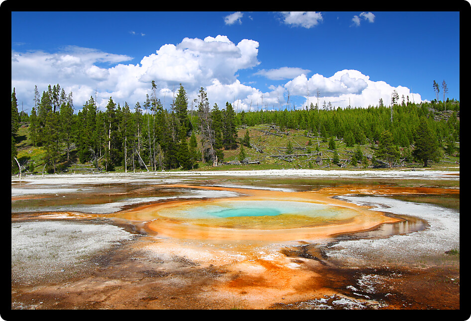 Light shimmers across the surface of Chromatic Pool in Yellowstone National Park USA.