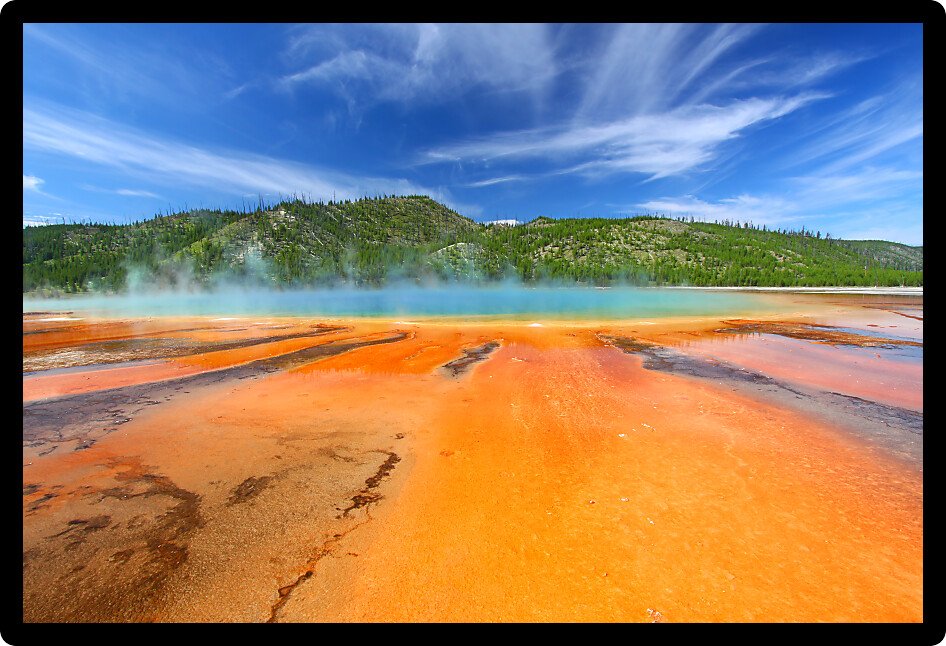 Grand Prismatic Spring on a beautiful summer day in Yellowstone National Park USA.