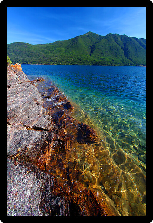 Beautiful glacial rocks of Lake McDonald in Glacier National Park of Montana.