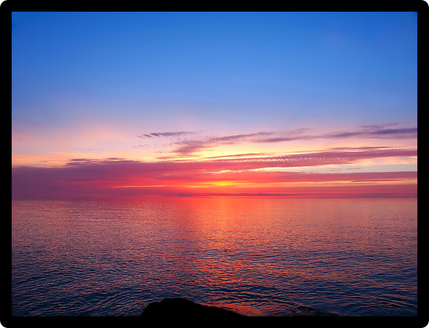 Beautiful pink colors reflect off Lake Superior in northern Michigan.
