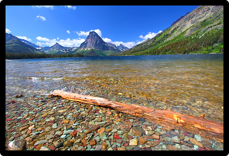 Mount Sinopah rises over Two Medicine Lake on a gorgeous summer day in Glacier National Park.