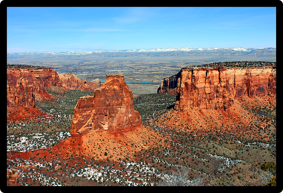 Eye catching rock formations tower over the valley at Colorado National Monument.