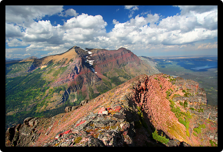 Mountaintop view of rugged alpine scenery in Glacier National Park.