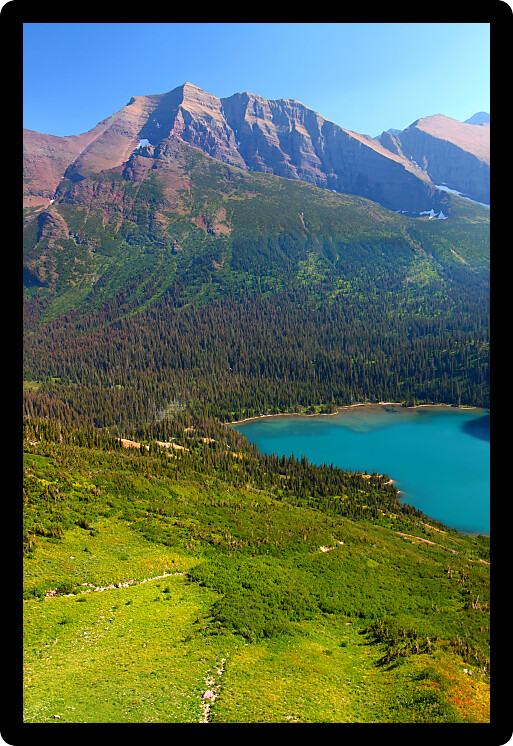 Grinnell Lake amidst the majestic mountain scenery of Glacier National Park in Montana.