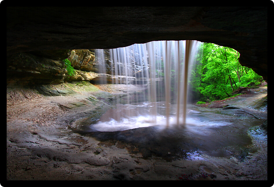 Rock overhang frames Lasalle Falls of Starved Rock State Park in central Illinois.