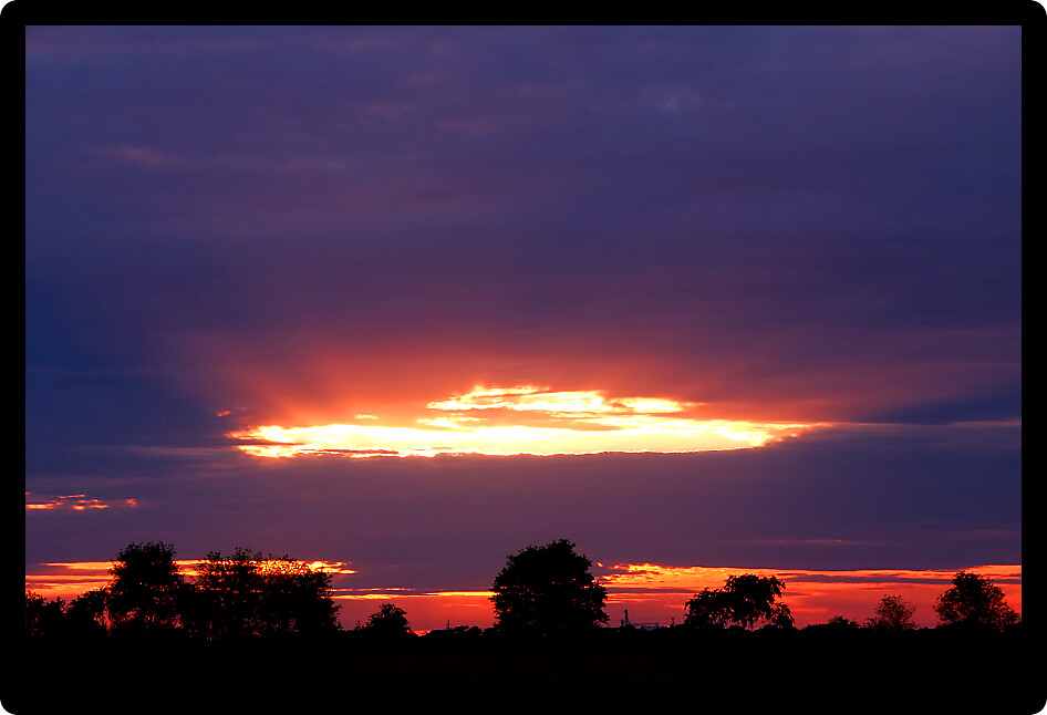 Rays of sunlight shine through approaching clouds in southern Wisconsin.