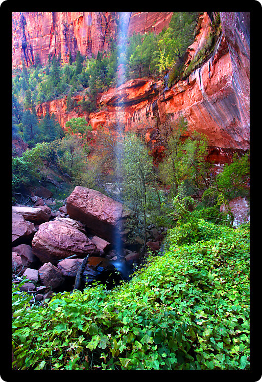 Waterfall flows into the Lower Emerald Pools of Zion National Park in Utah.