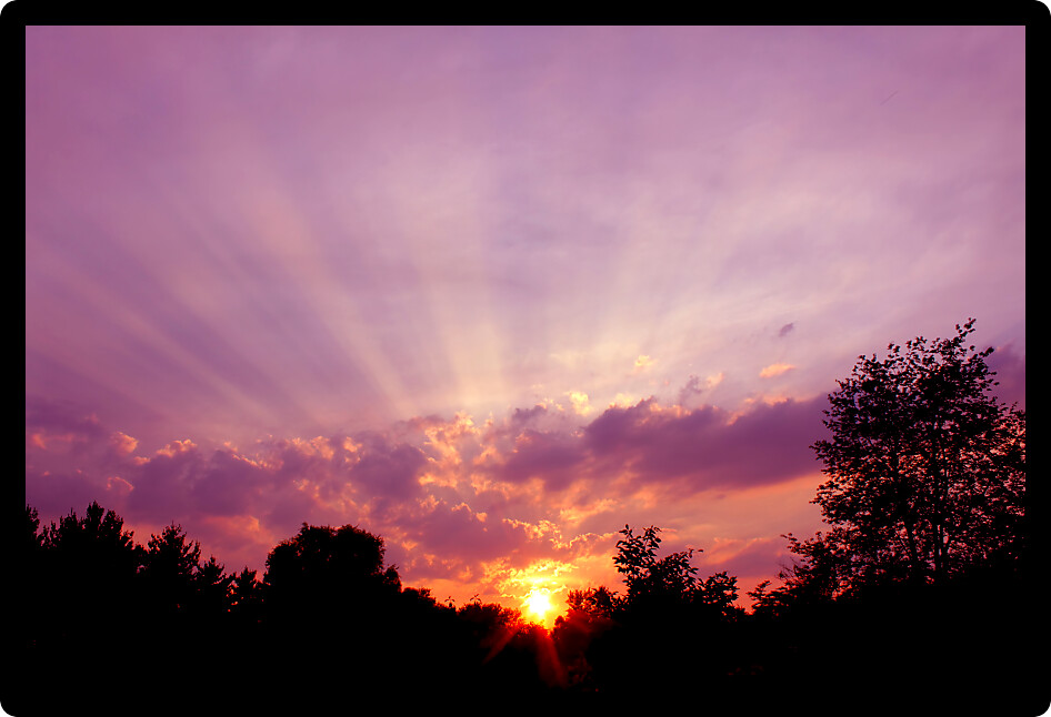 Rays of sunlight shine through the sunset clouds over northern Illinois.