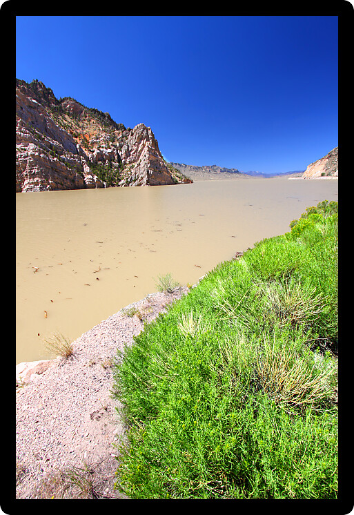 Muddy waters in the Buffalo Bill Reservoir on the Shoshone River of Wyoming.